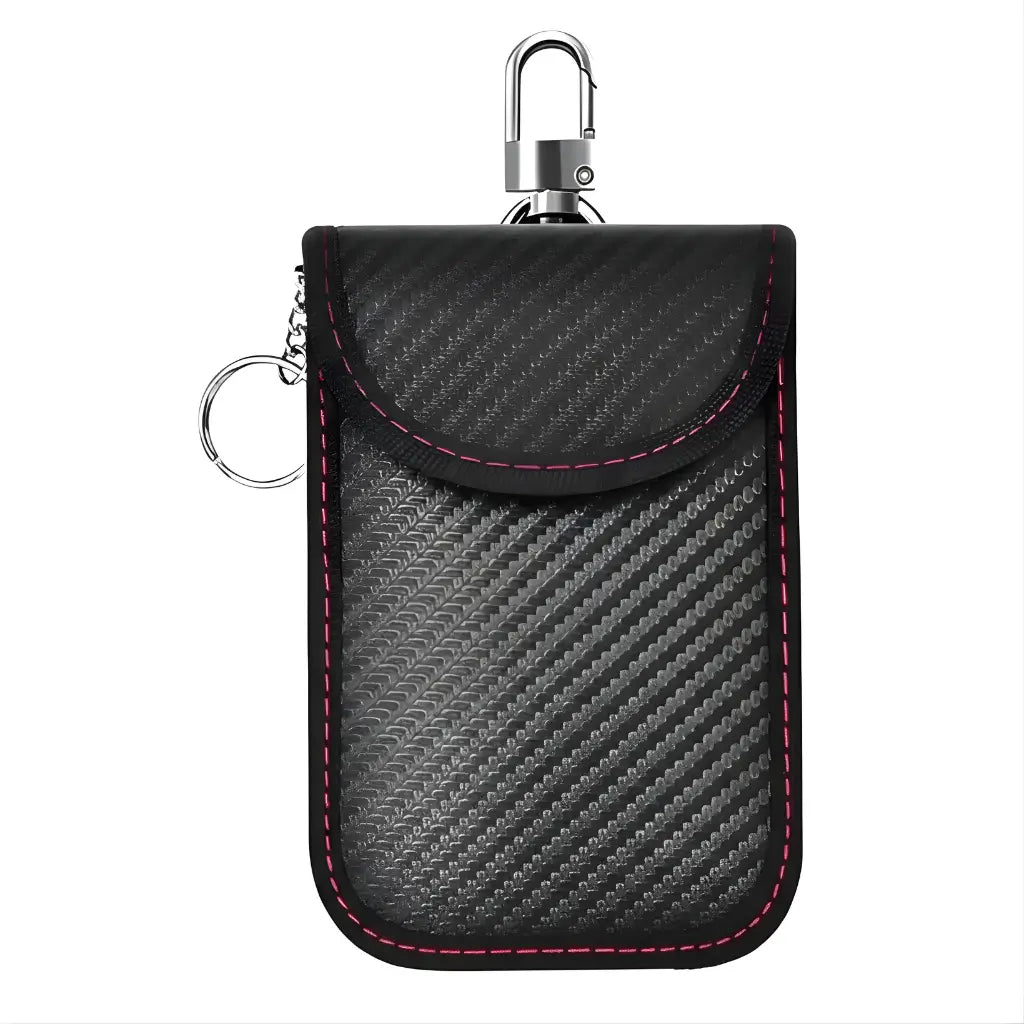 A Faraday key pouch with a car key beside it.